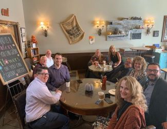 Group of AMA members meeting at a coffee shop
