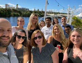 Group of many professional AMA volunteers at a regional retreat on a river boat